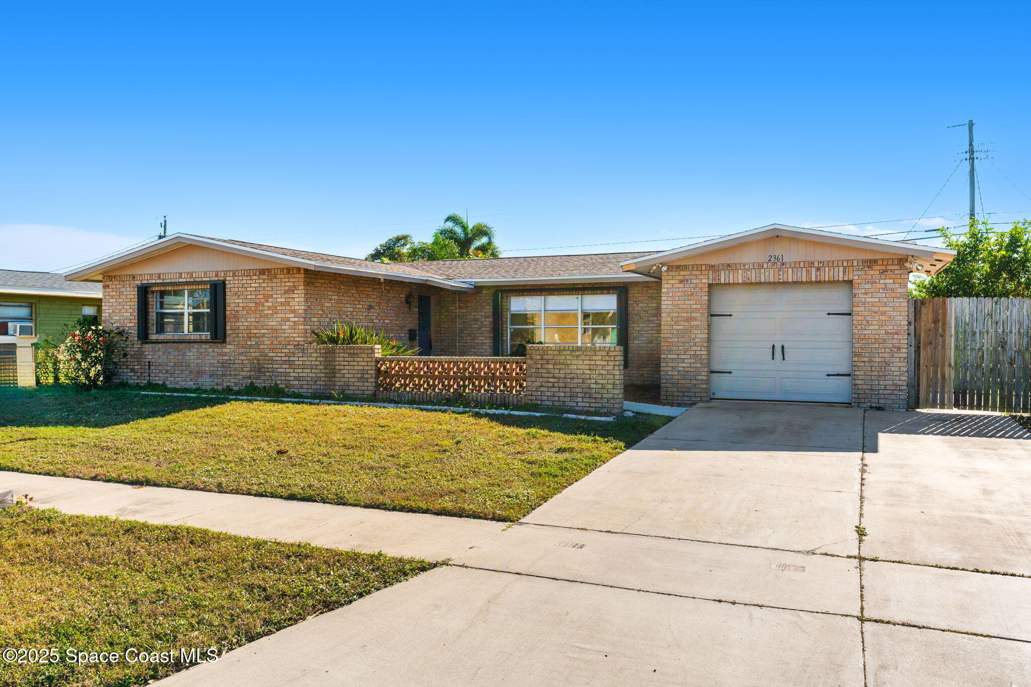 2361 Colony Drive Melbourne, FL 32935 - Photo 2 of 40 a front view of a house with yard