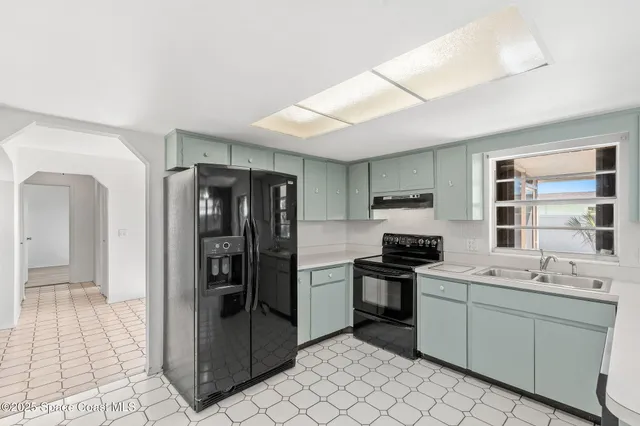 a view of a dining room with furniture and window