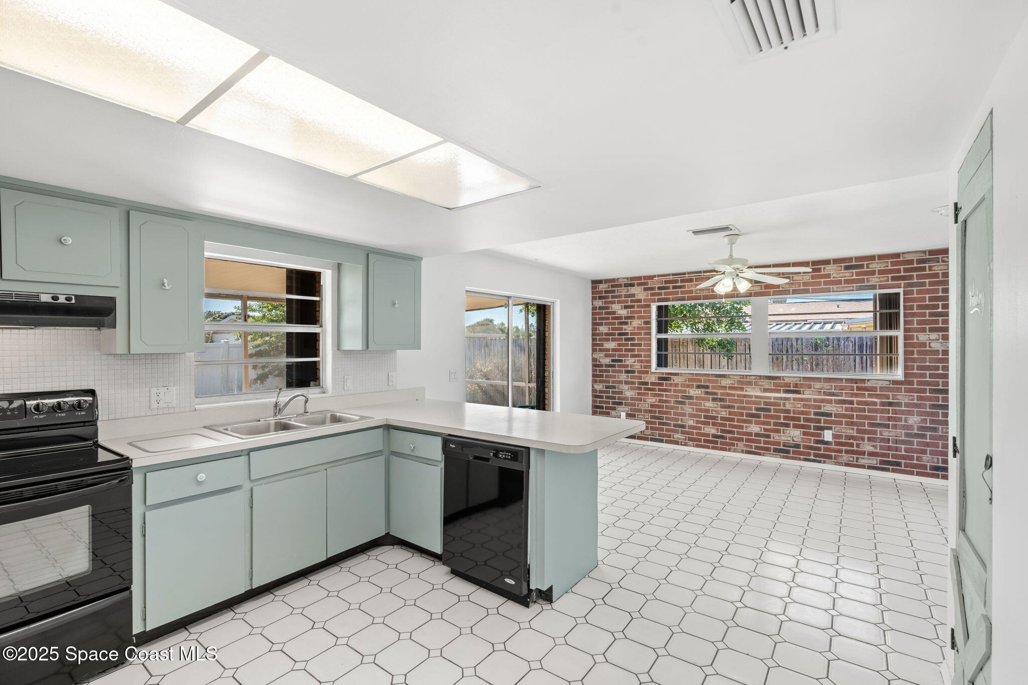 2361 Colony Drive Melbourne, FL 32935 - Photo 24 of 40 a kitchen with a sink cabinets and window
