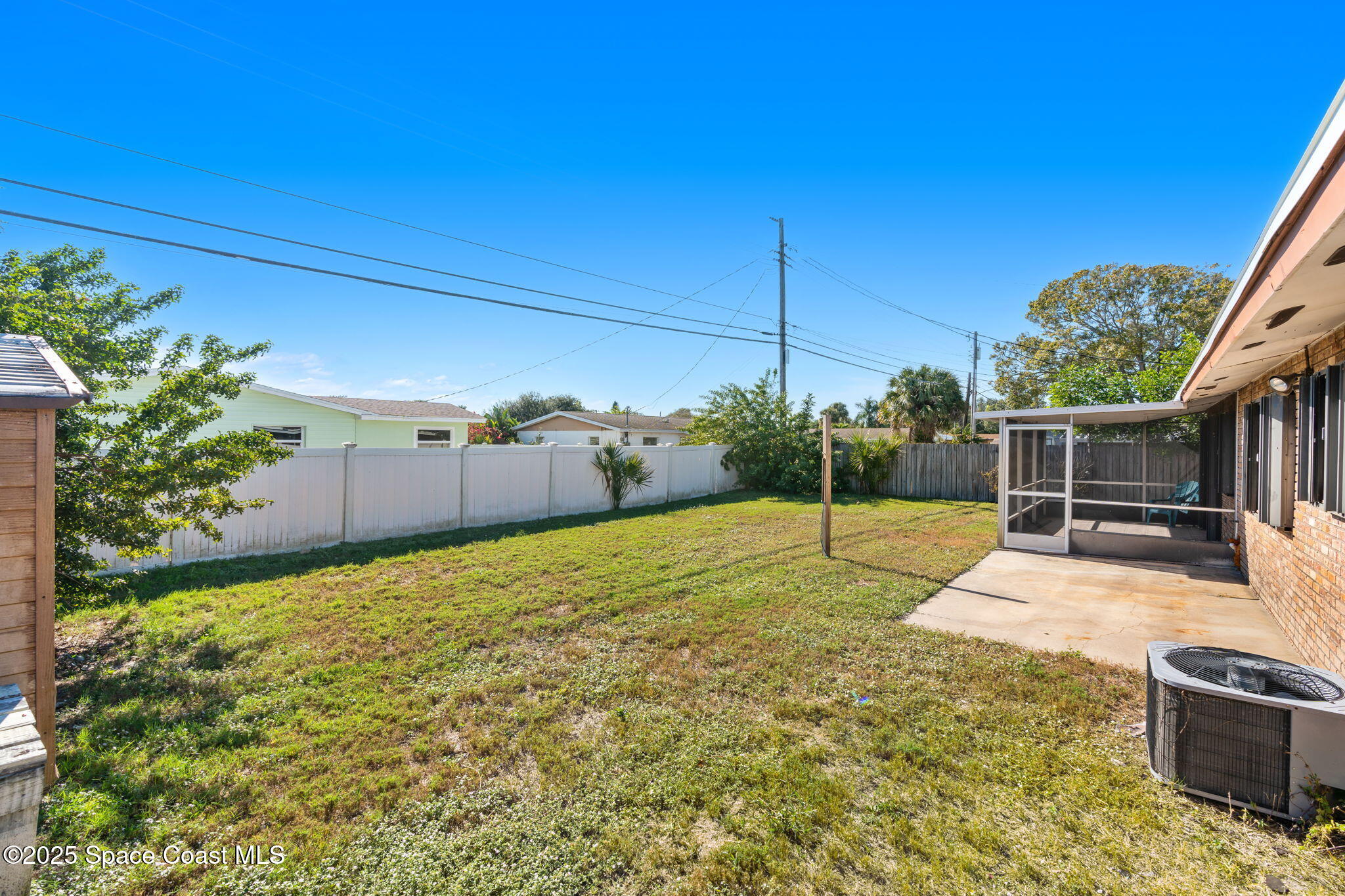 2361 Colony Drive Melbourne, FL 32935 - Photo 34 of 40 a backyard of a house with lots of green space