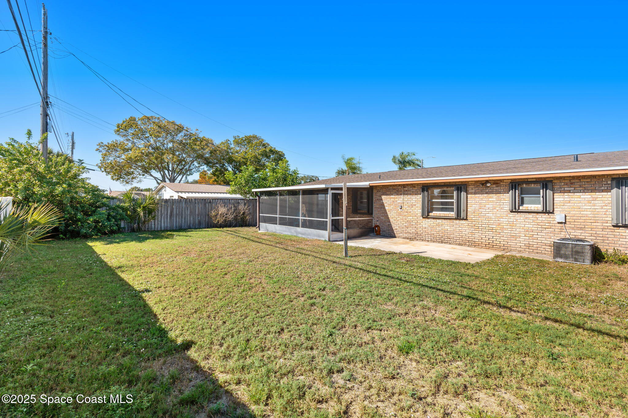 2361 Colony Drive Melbourne, FL 32935 - Photo 37 of 40 a front view of a house with a yard