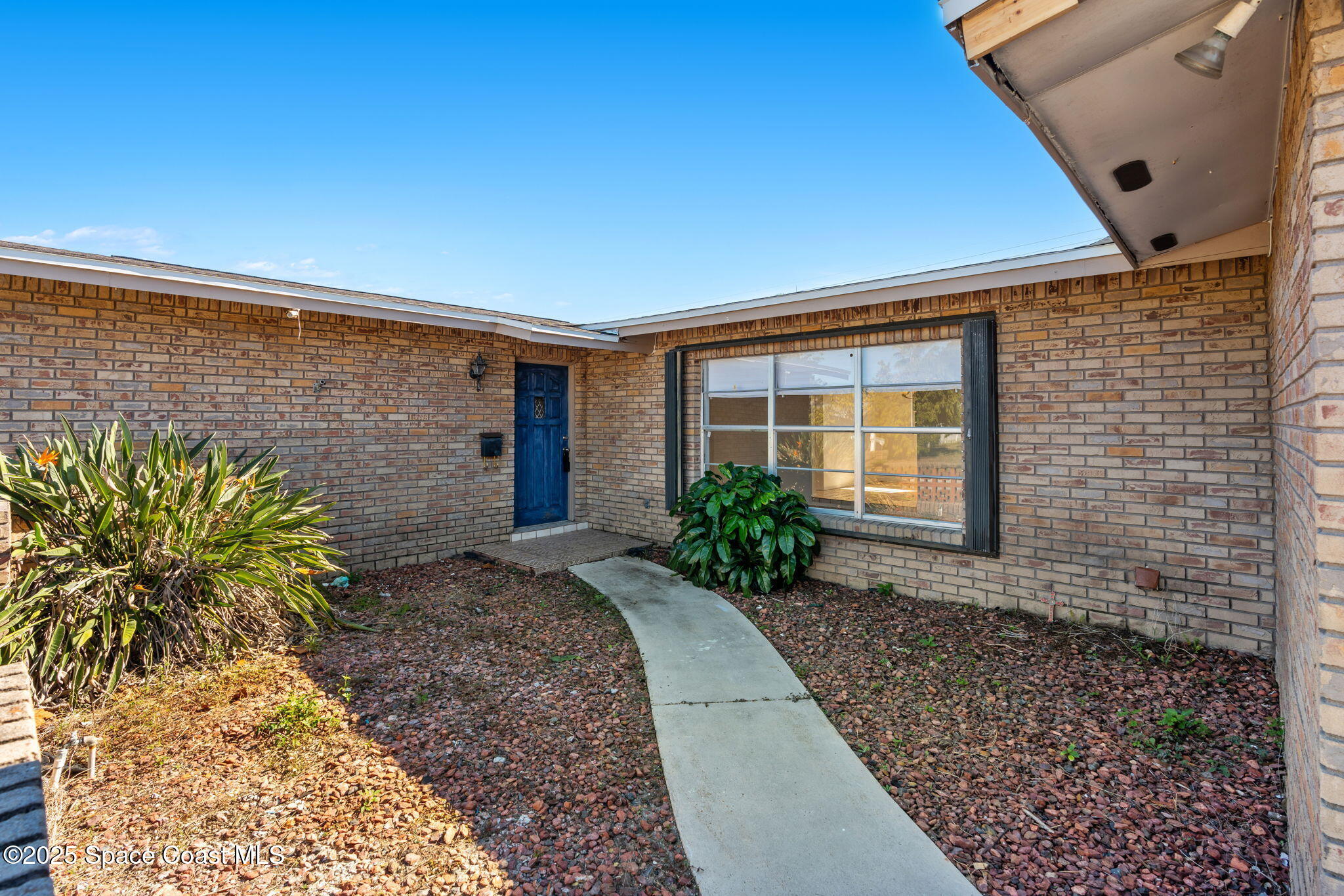 2361 Colony Drive Melbourne, FL 32935 - Photo 3 of 40 a view of a pathway with a house