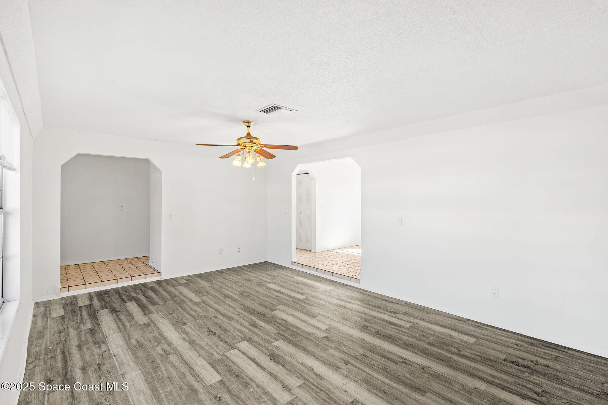 2361 Colony Drive Melbourne, FL 32935 - Photo 6 of 40 a view of a room with wooden floor