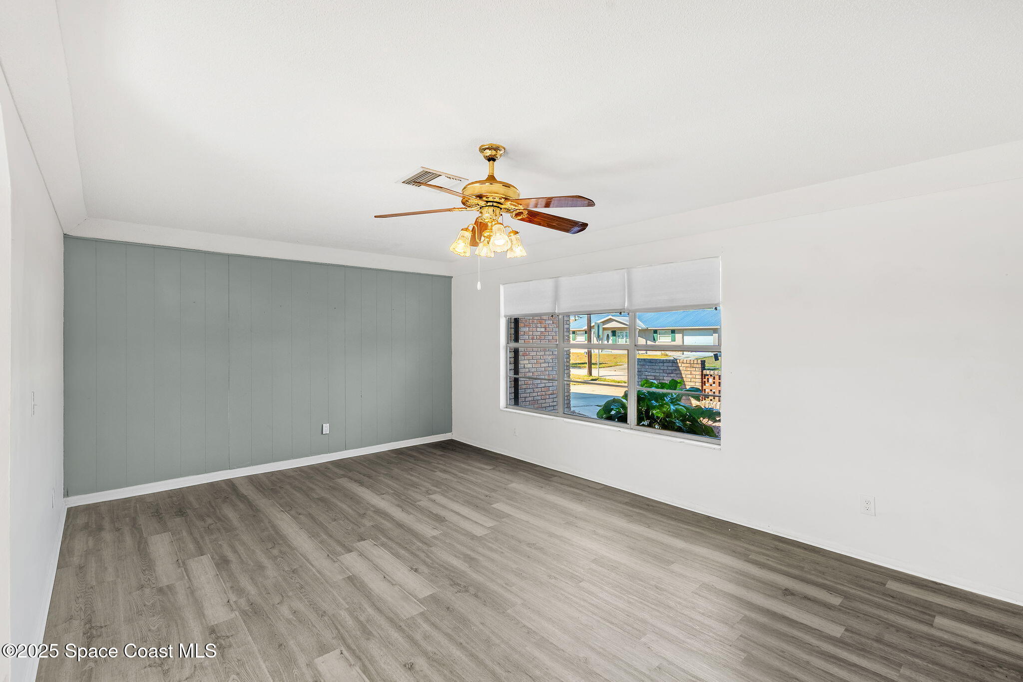 2361 Colony Drive Melbourne, FL 32935 - Photo 9 of 40 a view of room with window and ceiling fan