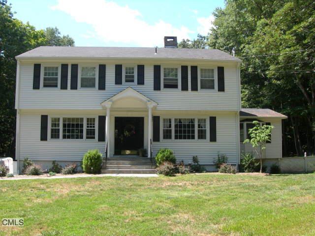 38 Hop Brook Road Brookfield, CT 06804 - Photo 1 of 1 a front view of a house with a yard and porch