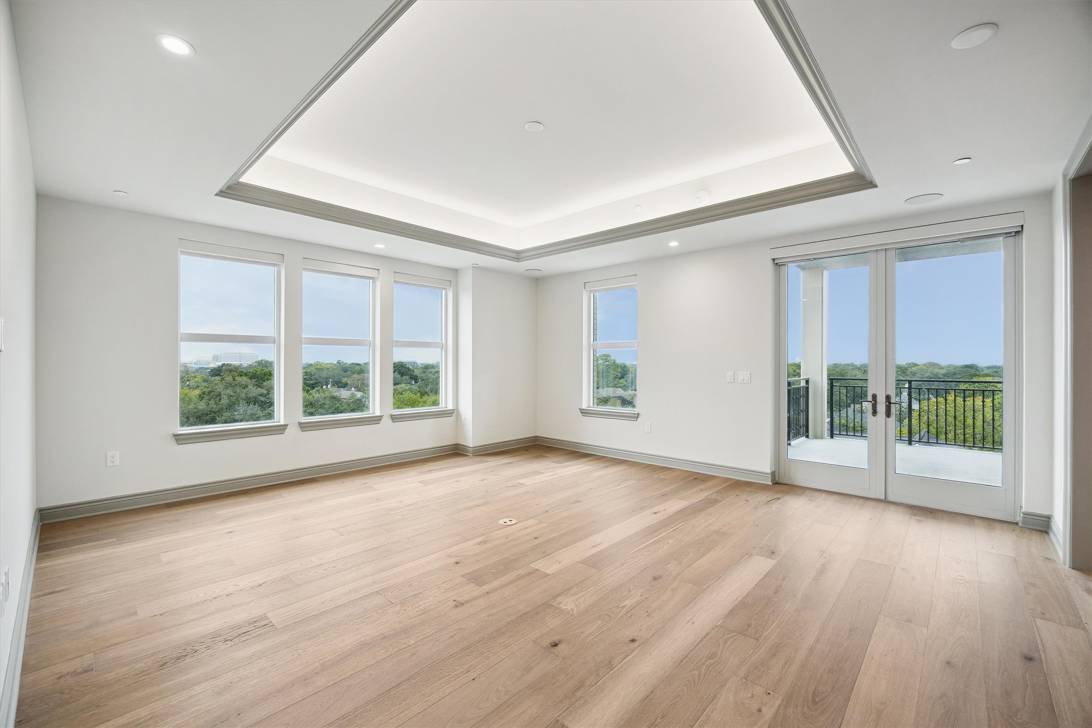 1717 Bissonnet Street, Unit 1106 Houston, TX 77005 - Photo 13 of 35 a view of an empty room with wooden floor and a window