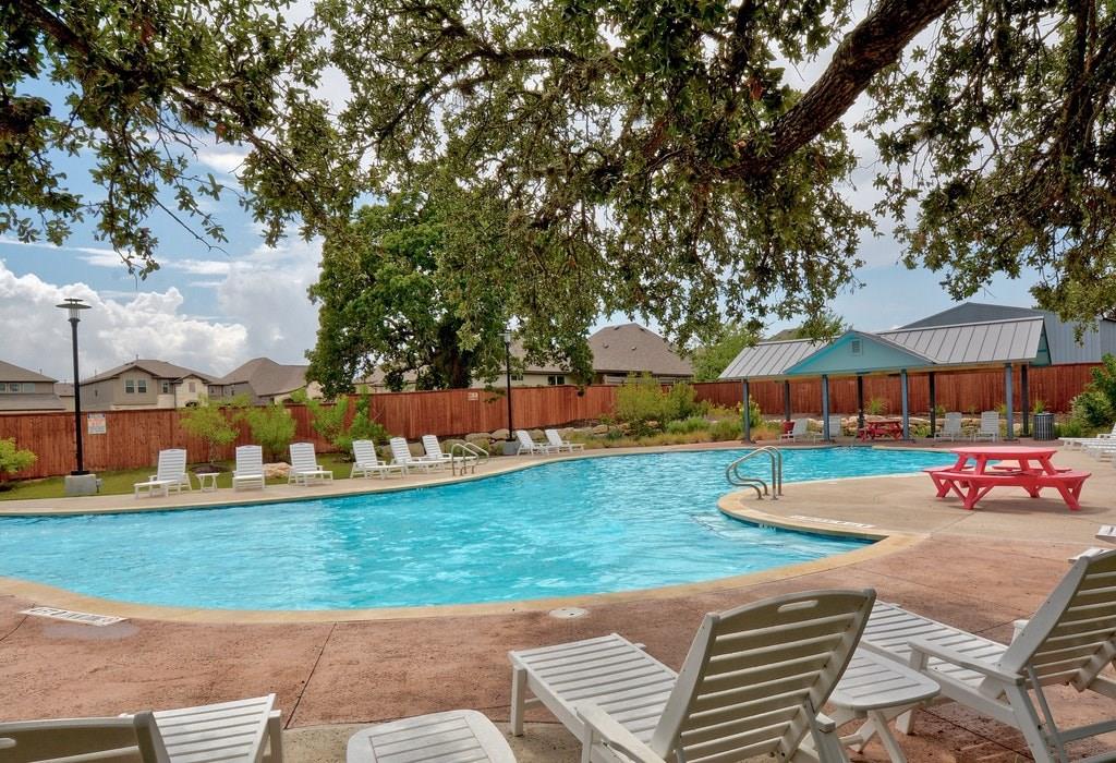 13216 Mariscan Street Manchaca, TX 78652 - Photo 21 of 28 Community pool with a patio