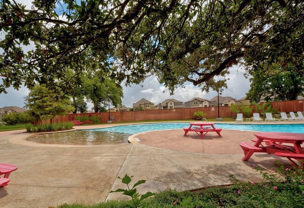 13216 Mariscan Street Manchaca, TX 78652 - Photo 24 of 28 Community pool with a patio area