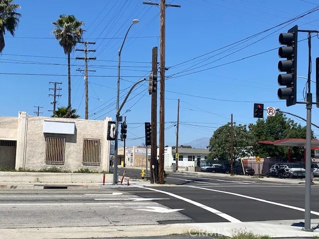 a view of a city street with cars