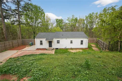 a house view with a backyard space
