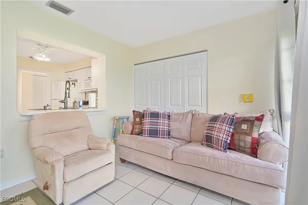 a kitchen with cabinets and a refrigerator
