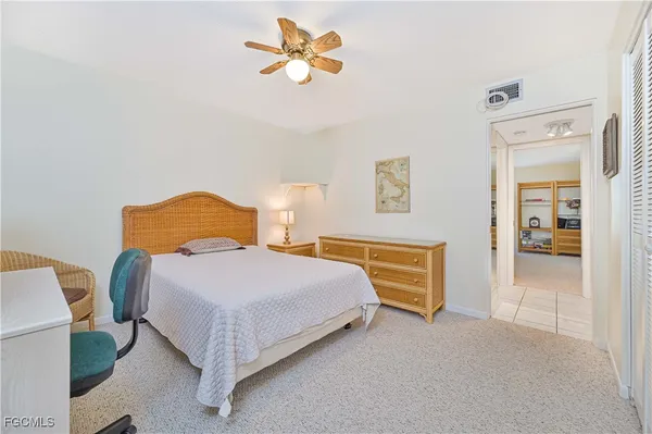 a bathroom with a sink a toilet and shower curtain