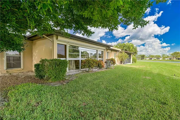 a view of a golf course with a lake