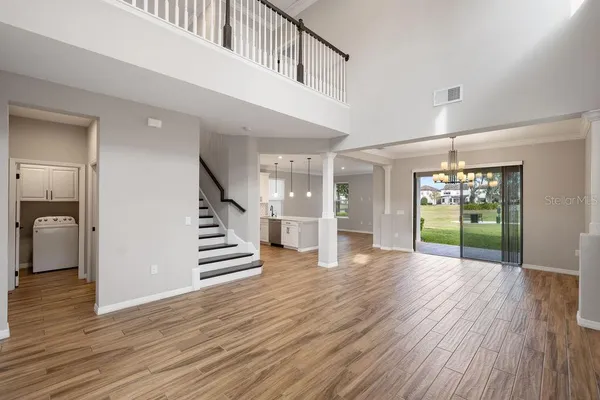 a view of an entryway with wooden floor