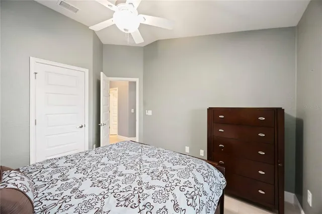 a bedroom with a bed and a dresser