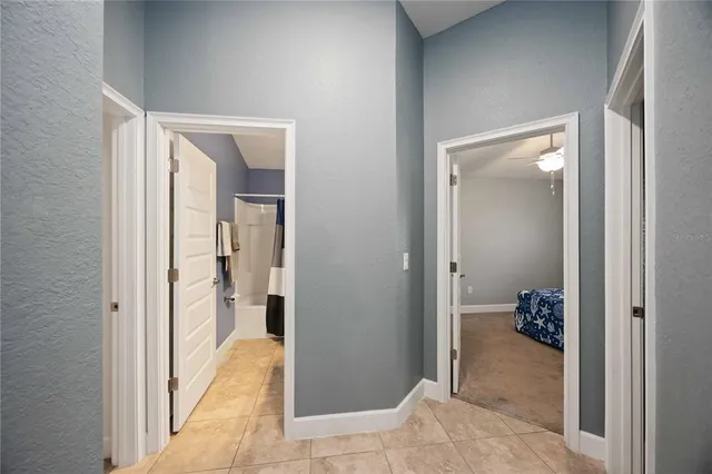 a view of a hallway and closet and a livingroom view