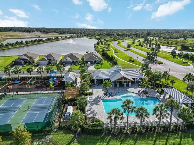 a view of a city with lawn chairs and a table