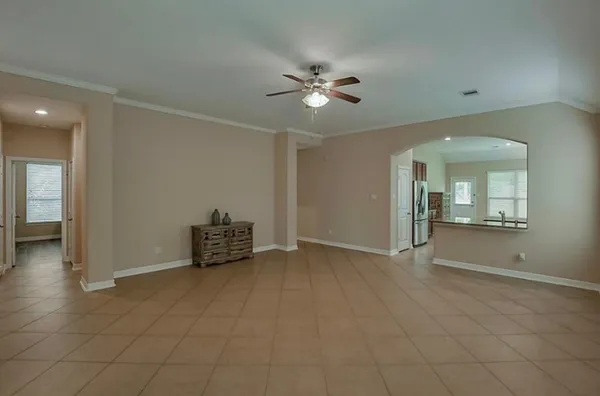 a view of an empty room with a bathroom