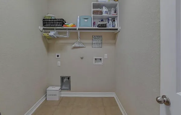 a bedroom with a bed and a flat tv screen on dresser