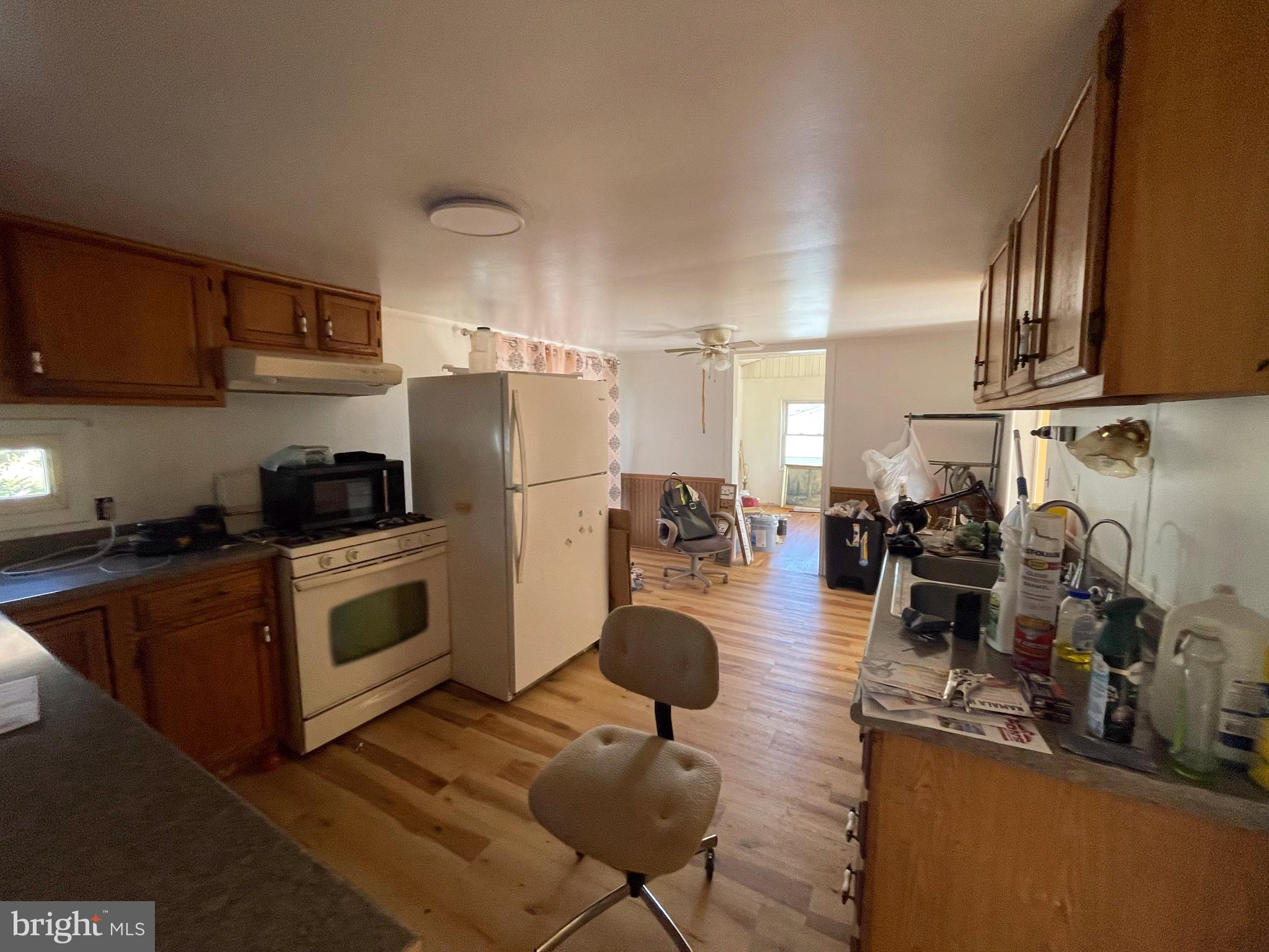 161 Pepple Road East Freedom, PA 16637 - Photo 13 of 14 a kitchen with sink a refrigerator and chairs