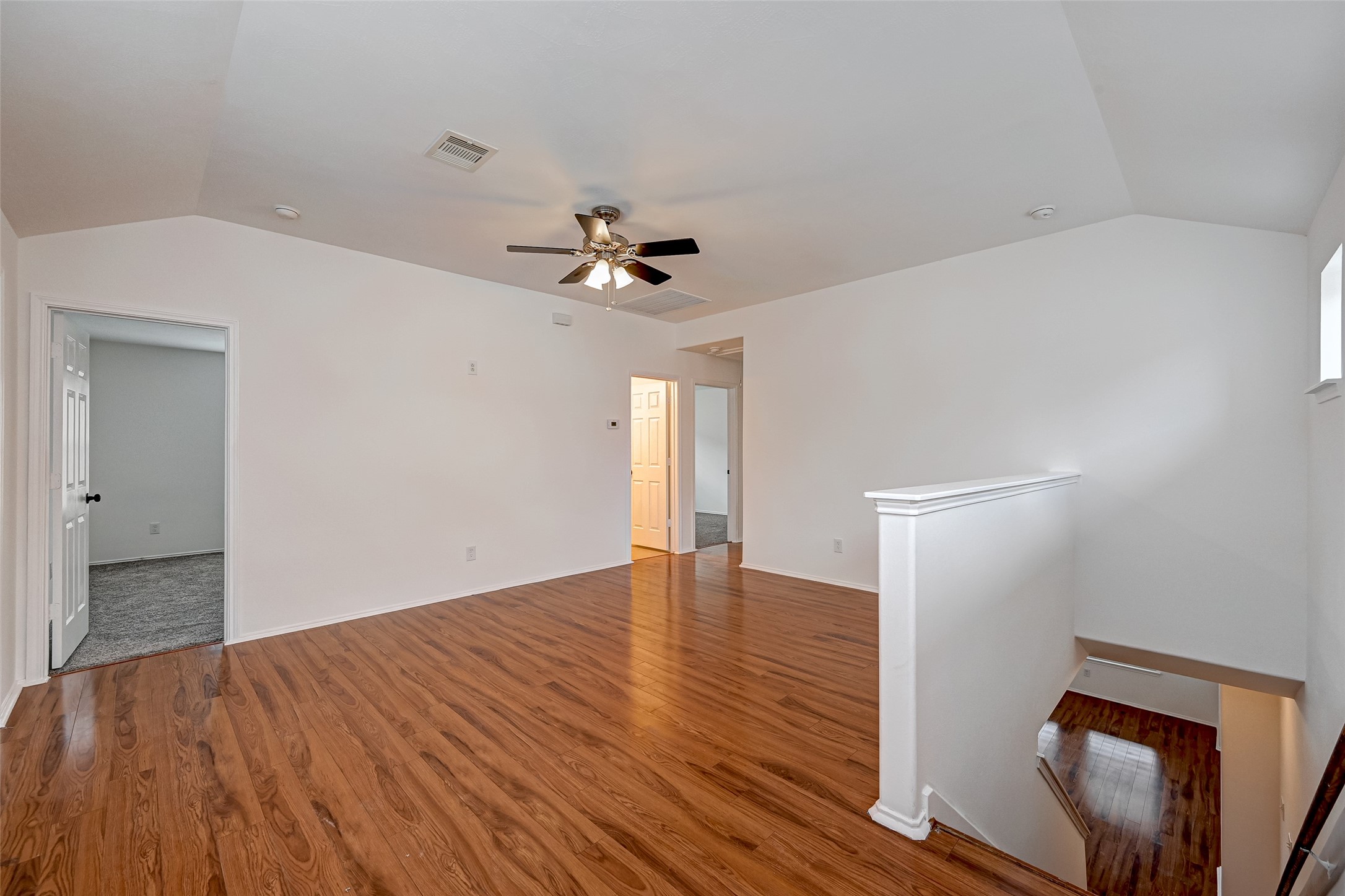 6906 Anson Point Lane Houston, TX 77040 - Photo 17 of 31 a view of empty room with wooden floor and fan