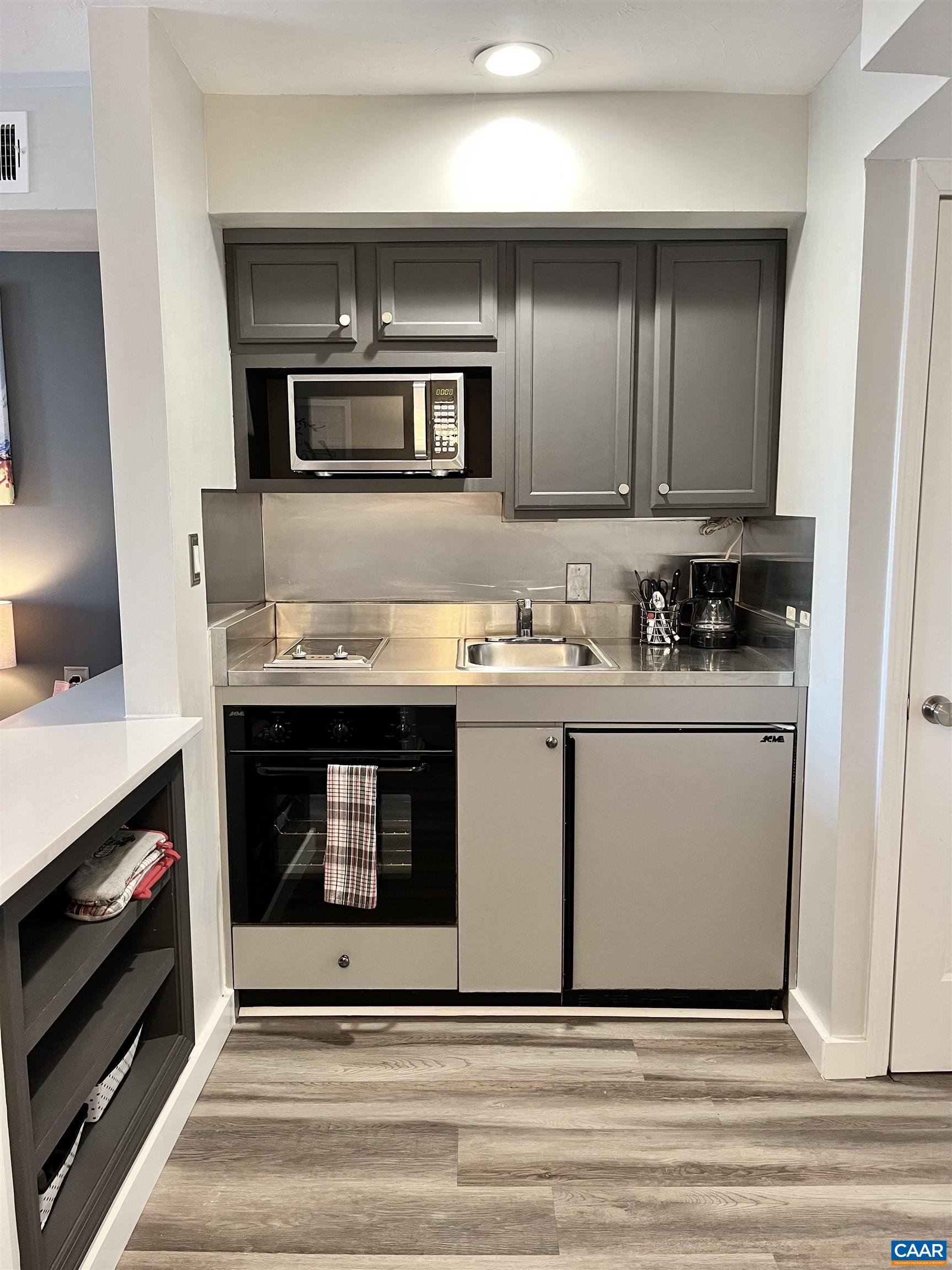 2052 Stone Ridge Wintergreen, VA 22967 - Photo 6 of 17 a kitchen with stainless steel appliances granite countertop a stove and a microwave