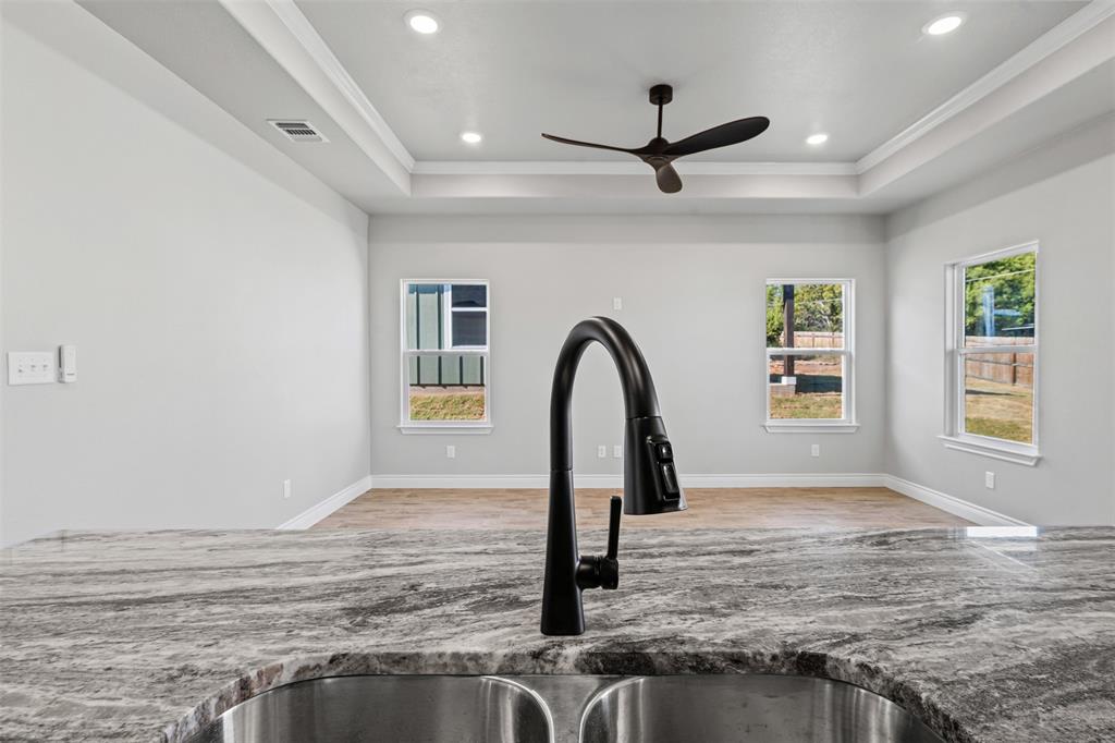 3400 Hilltop Road Granbury, TX 76048 - Photo 20 of 40 a view of empty room with window and ceiling fan