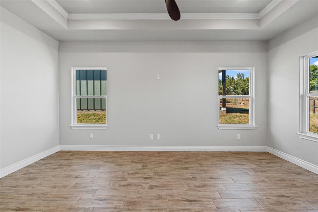 3400 Hilltop Road Granbury, TX 76048 - Photo 21 of 40 a view of an empty room with window
