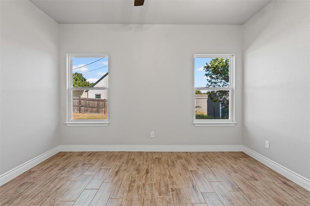3400 Hilltop Road Granbury, TX 76048 - Photo 24 of 40 an empty room with a window