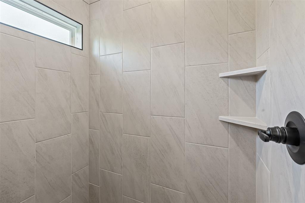 3400 Hilltop Road Granbury, TX 76048 - Photo 27 of 40 a bathroom with a shower