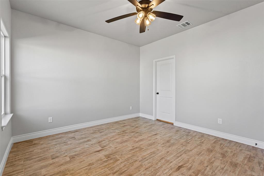 3400 Hilltop Road Granbury, TX 76048 - Photo 28 of 40 wooden floor in an empty room