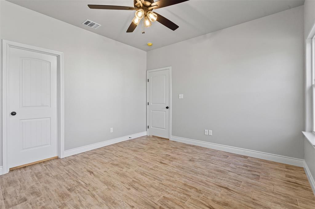 3400 Hilltop Road Granbury, TX 76048 - Photo 29 of 40 wooden floor in an empty room