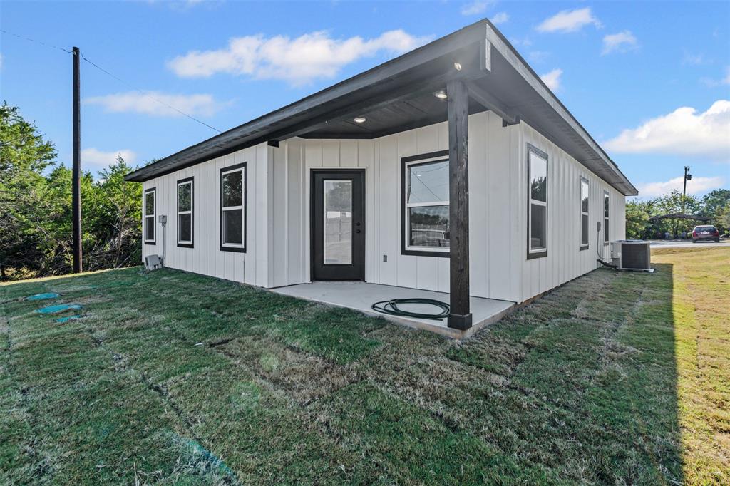 3400 Hilltop Road Granbury, TX 76048 - Photo 35 of 40 a front view of a house with garden