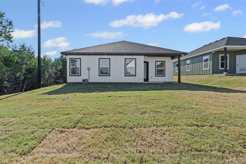 3400 Hilltop Road Granbury, TX 76048 - Photo 39 of 40 a house view with a garden space