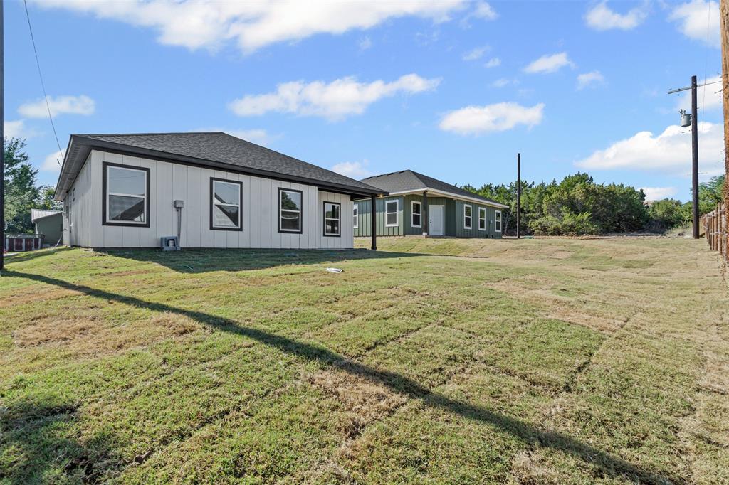 3400 Hilltop Road Granbury, TX 76048 - Photo 40 of 40 a front view of a house with a yard