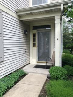 347 Emerald Lane, Unit 347 Algonquin, IL 60102 - Photo 2 of 11 a view of a door with a bench and a yard