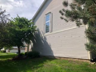 347 Emerald Lane, Unit 347 Algonquin, IL 60102 - Photo 10 of 11 a view of a white house next to a yard