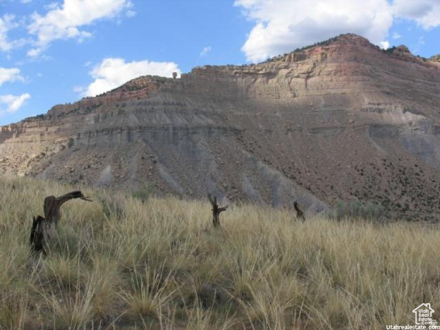 700 Spring Canyon Road Helper, UT 84526 - Photo 10 of 19 Expansive natural landscape featuring a prominent mountain backdrop with visible rock formations and arid vegetation