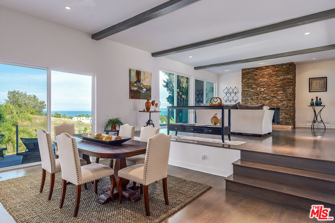 28907 Wight Road Malibu, CA 90265 - Photo 14 of 54 a dining room with furniture and wooden floor