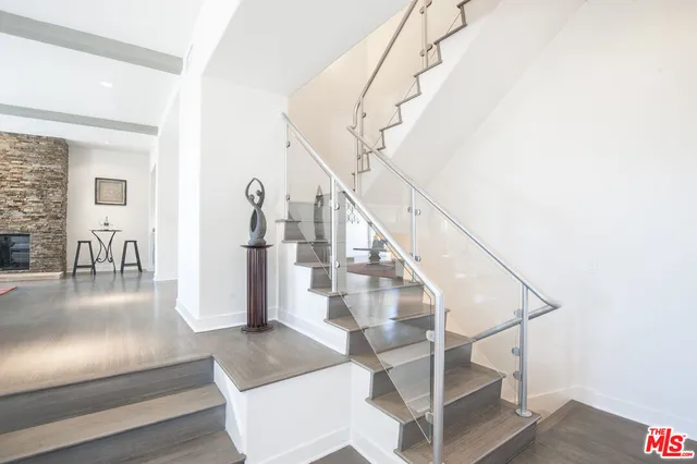 a view of a workspace with furniture and a potted plant