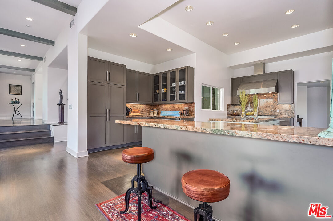 28907 Wight Road Malibu, CA 90265 - Photo 23 of 54 a kitchen with stainless steel appliances a sink and a refrigerator
