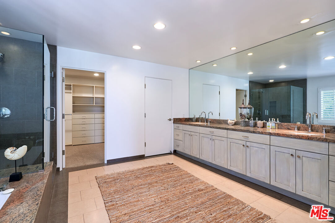 28907 Wight Road Malibu, CA 90265 - Photo 37 of 54 a large bathroom with a sink and a mirror