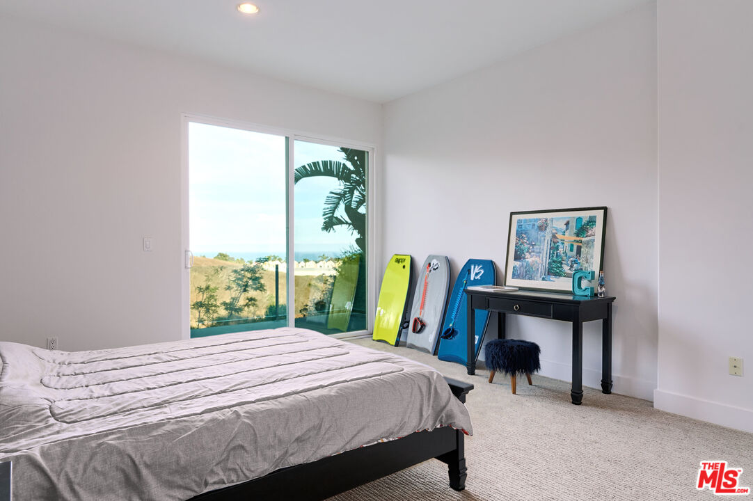 28907 Wight Road Malibu, CA 90265 - Photo 48 of 54 a bed sitting in a bedroom next to a window