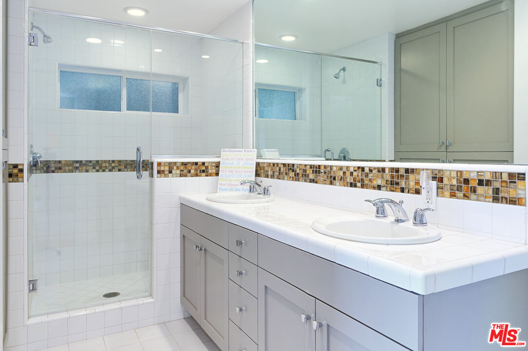 28907 Wight Road Malibu, CA 90265 - Photo 49 of 54 a bathroom with a sink and a mirror