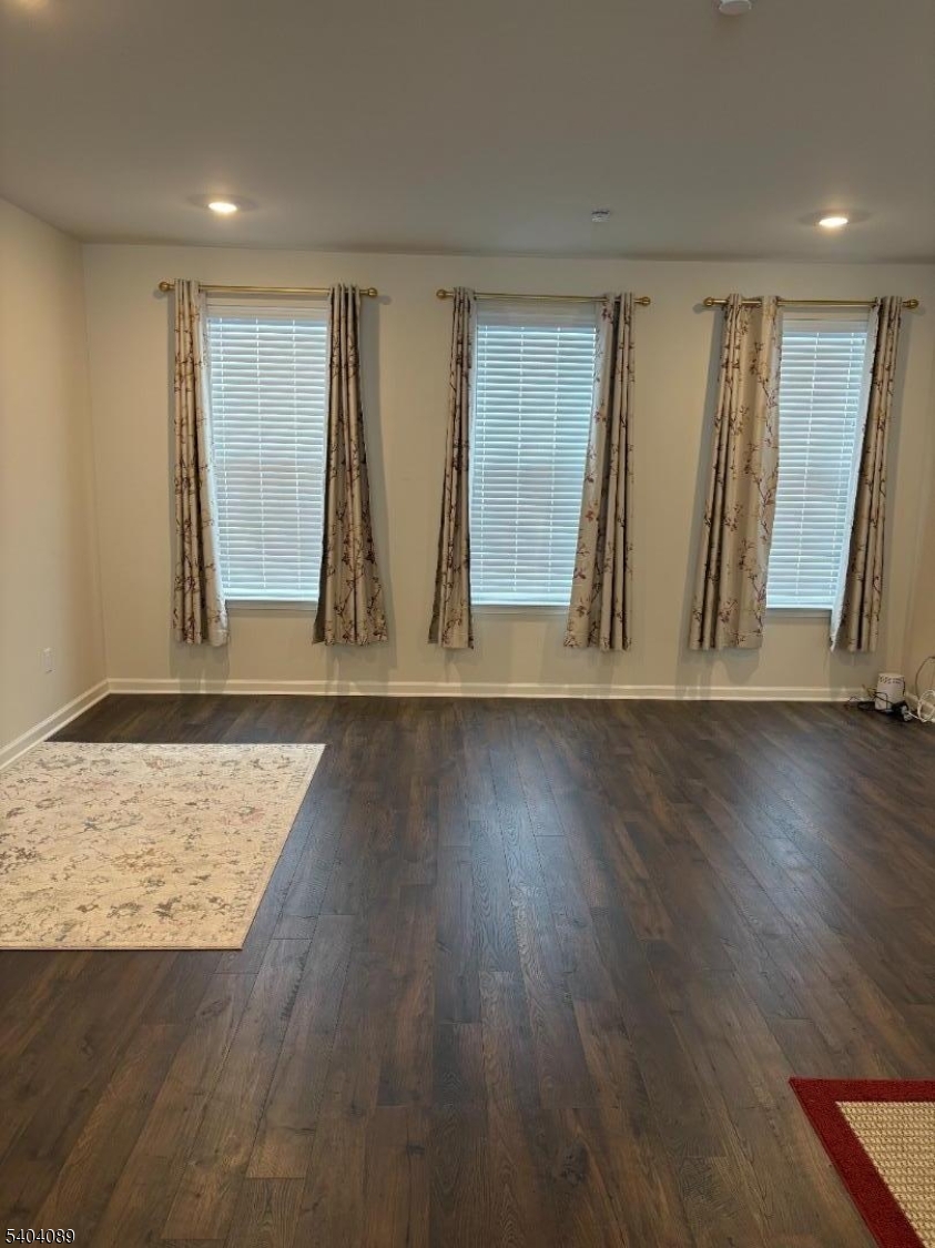 10 Stanton Rd Mount Mount Holly, NJ 08060 - Photo 5 of 9 an empty room with wooden floor and window