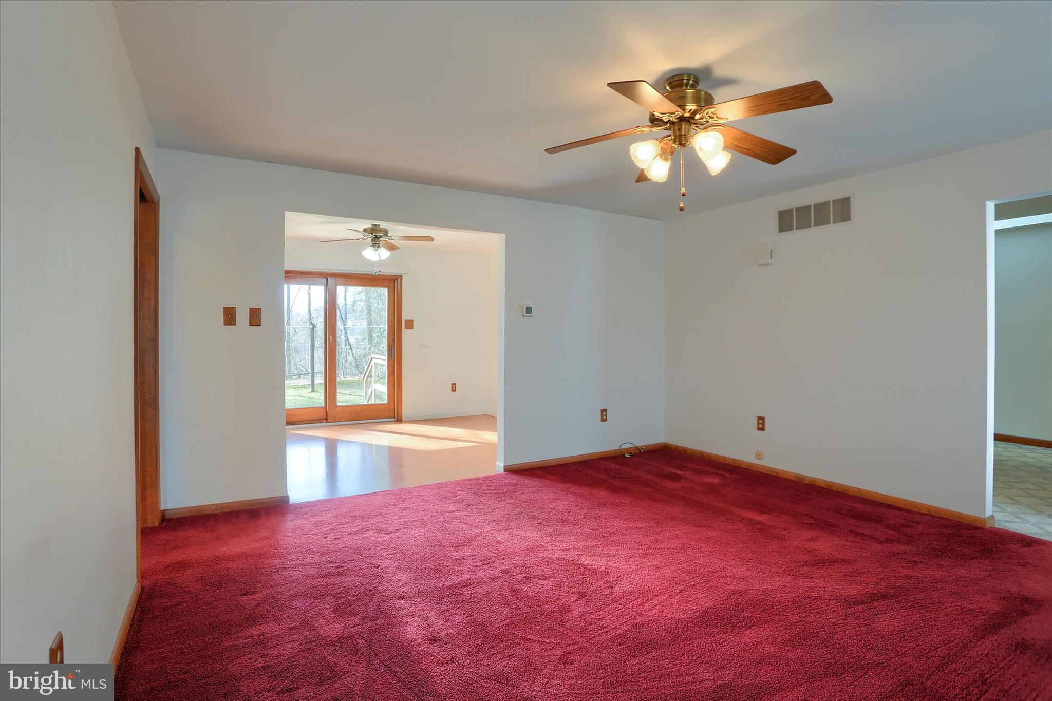 149 Stone Mountain Road Pine Grove, PA 17963 - Photo 13 of 64 a view of an empty room with a chandelier fan and a window