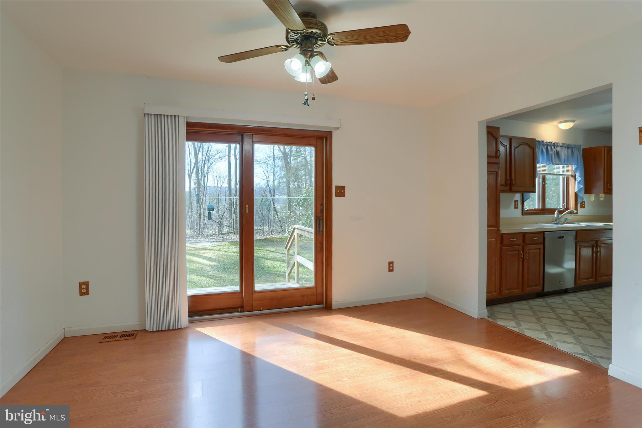 149 Stone Mountain Road Pine Grove, PA 17963 - Photo 15 of 64 a view of an empty room with a window and kitchen view