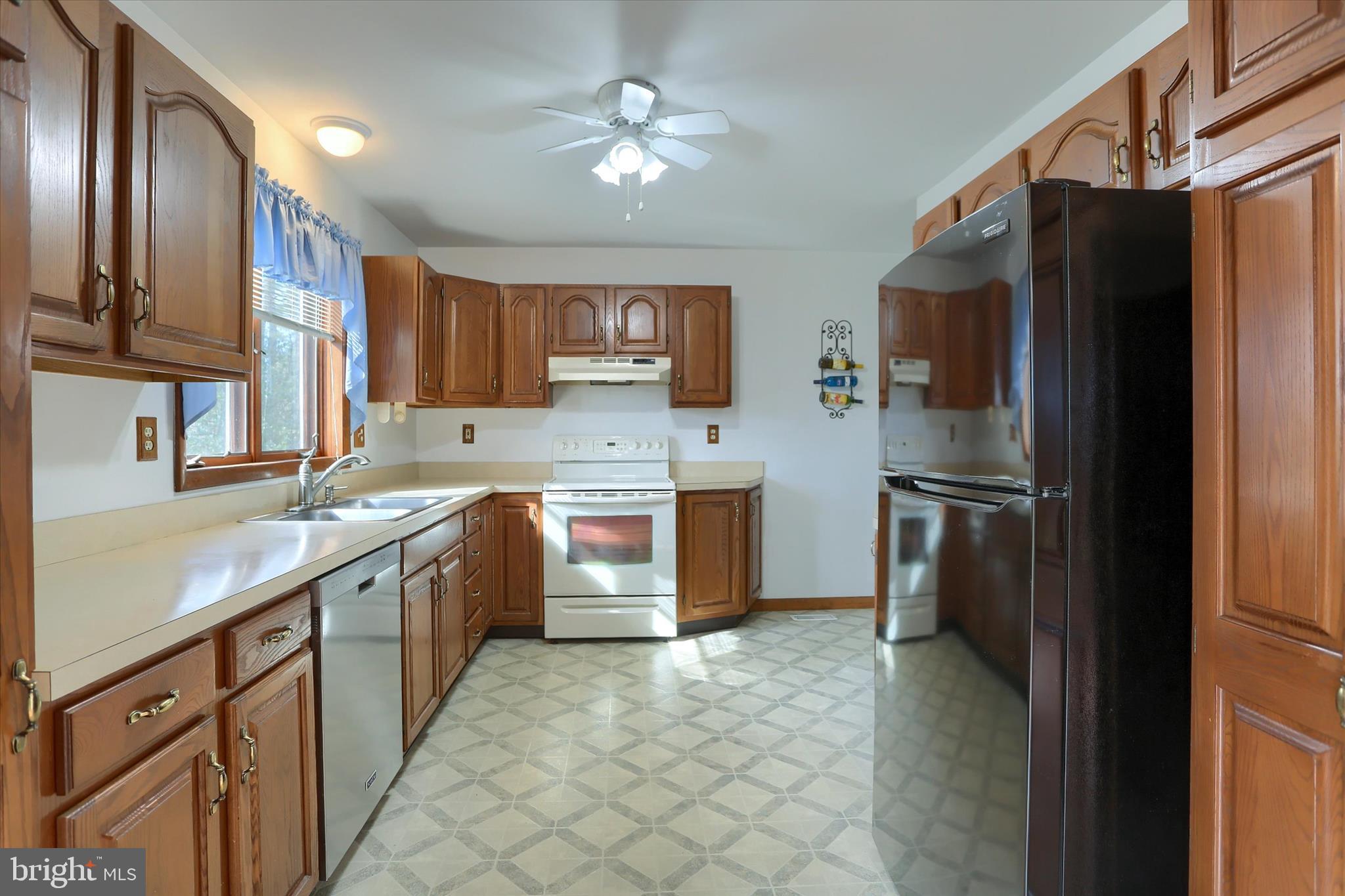 149 Stone Mountain Road Pine Grove, PA 17963 - Photo 19 of 64 a kitchen with a refrigerator sink and cabinets