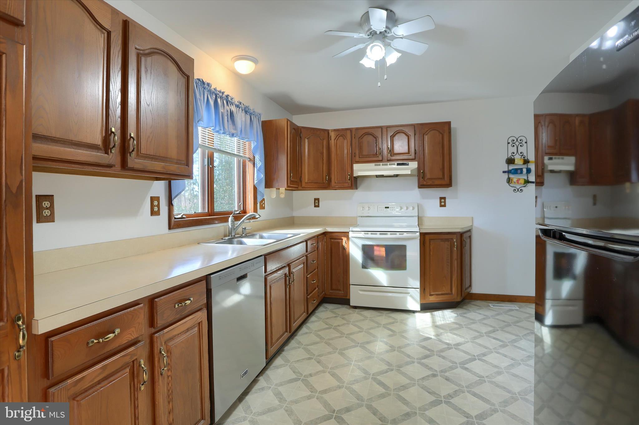 149 Stone Mountain Road Pine Grove, PA 17963 - Photo 20 of 64 a kitchen with stainless steel appliances granite countertop a sink counter space cabinets and a stove