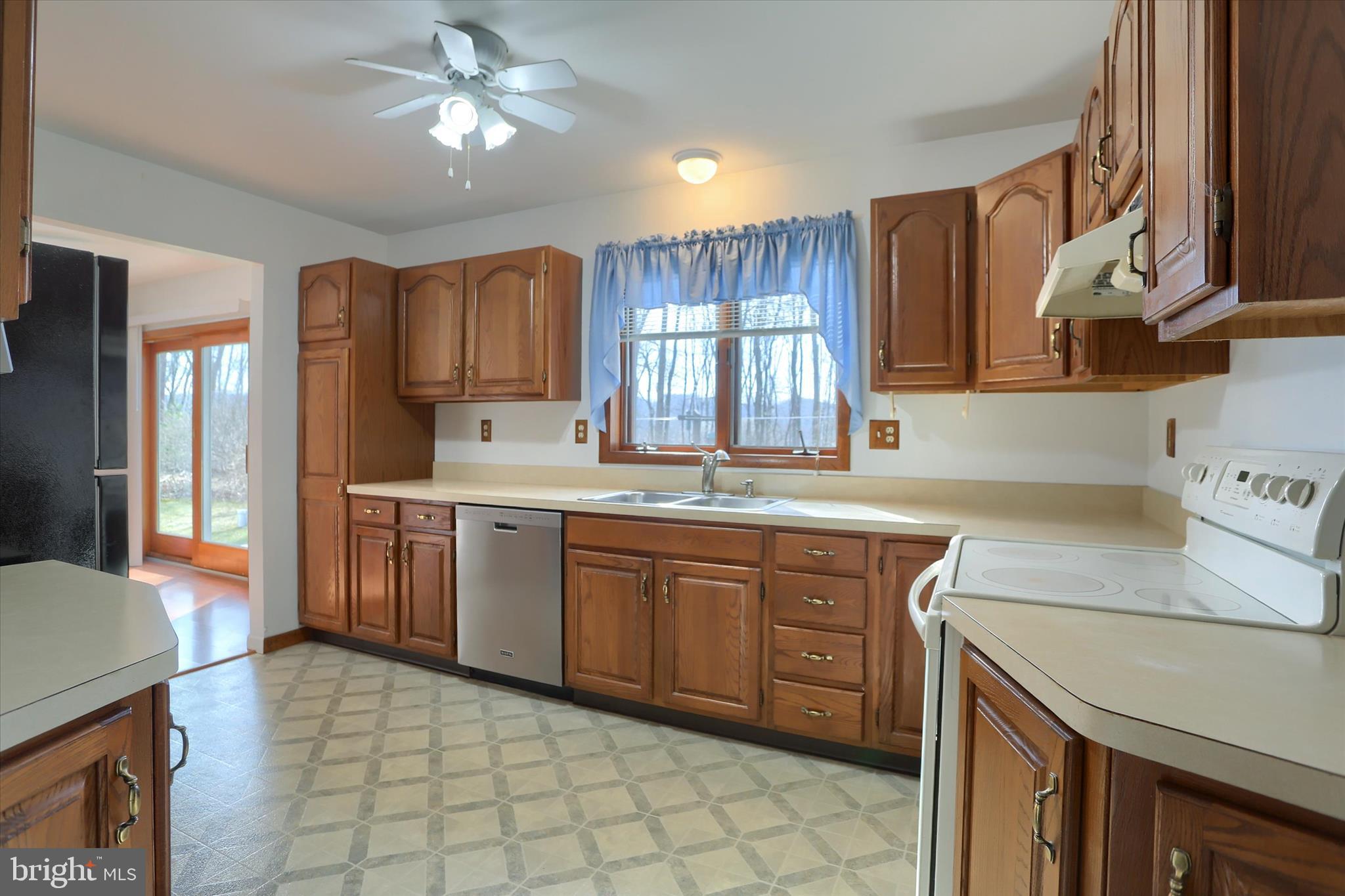 149 Stone Mountain Road Pine Grove, PA 17963 - Photo 21 of 64 a kitchen with a sink stove and cabinets